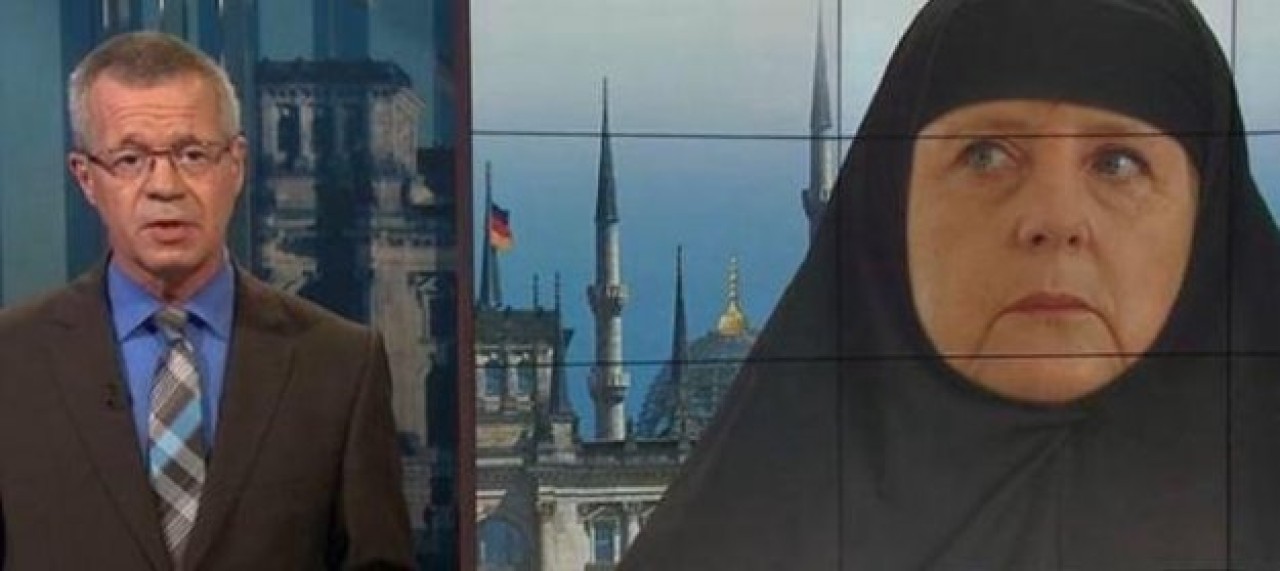 Devlet televizyonunda Merkele kara çarşaf giydirdiler