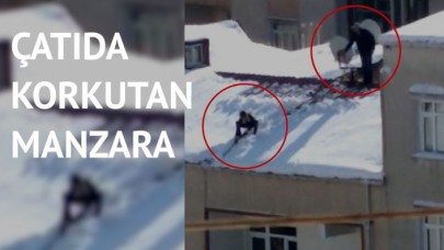 Çocuğu iple bağlayıp çatıdaki karı temizletti